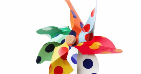 A brightly colored pinwheel. Learn about humanized decarbonization in this podcast!