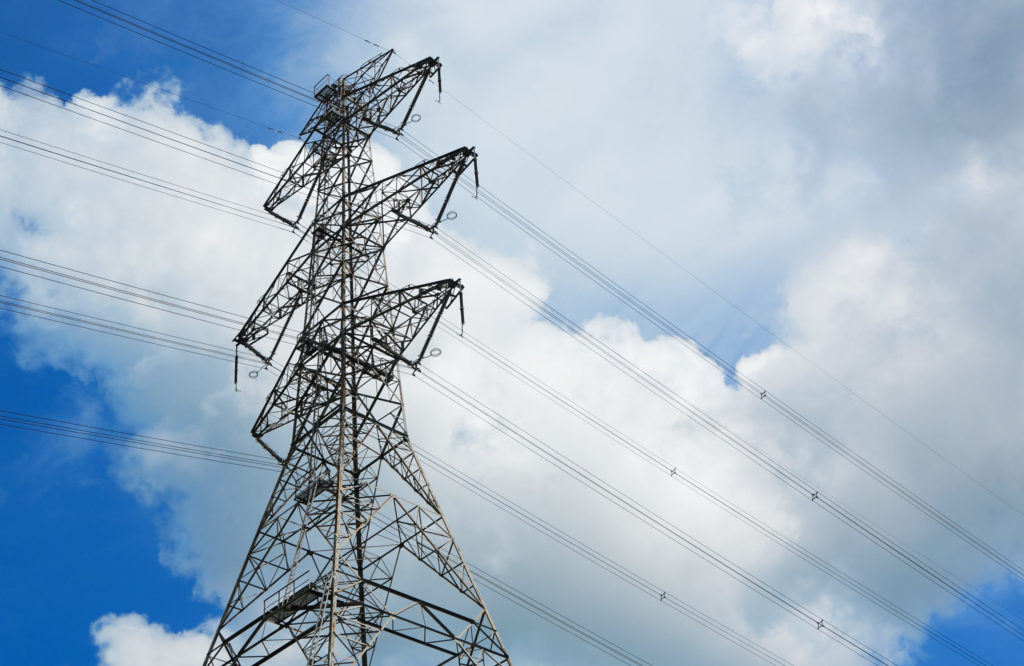 A power transmission tower. Learn some decarbonization trends in this podcast with Angel Lance!